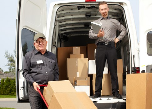 Business team planning a commercial relocation with a move van